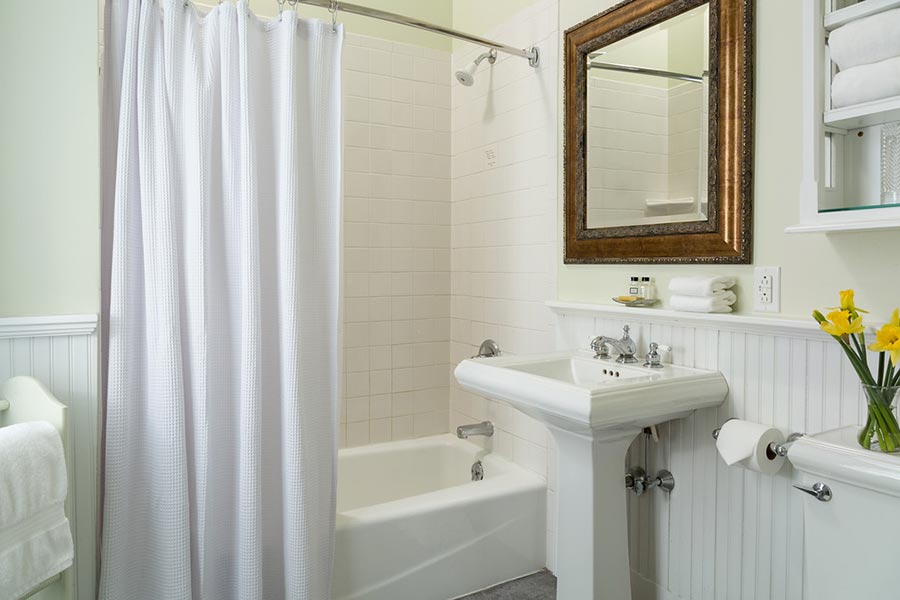 Bathroom showing sink and tub of hotel