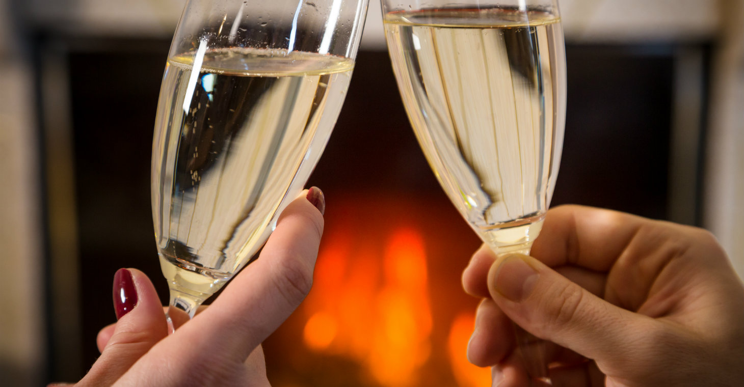 Champagne toast in front of the fire