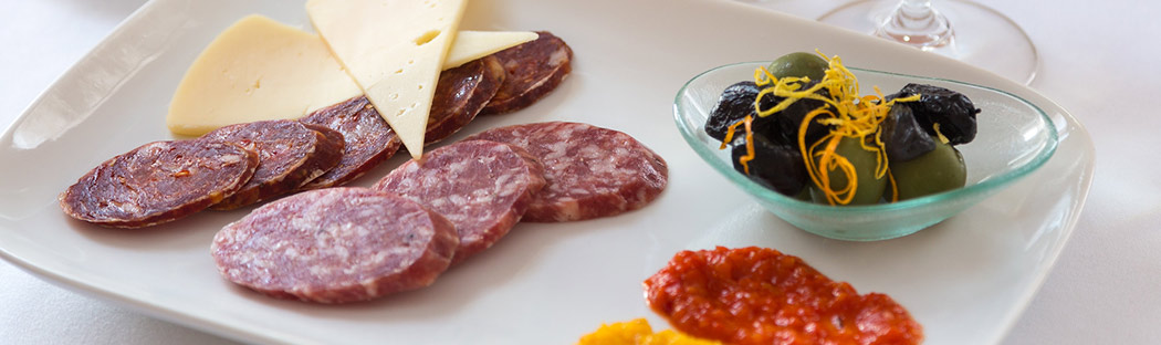 Small plate food of meats and olives