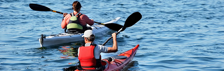 Couple kayaking in lake