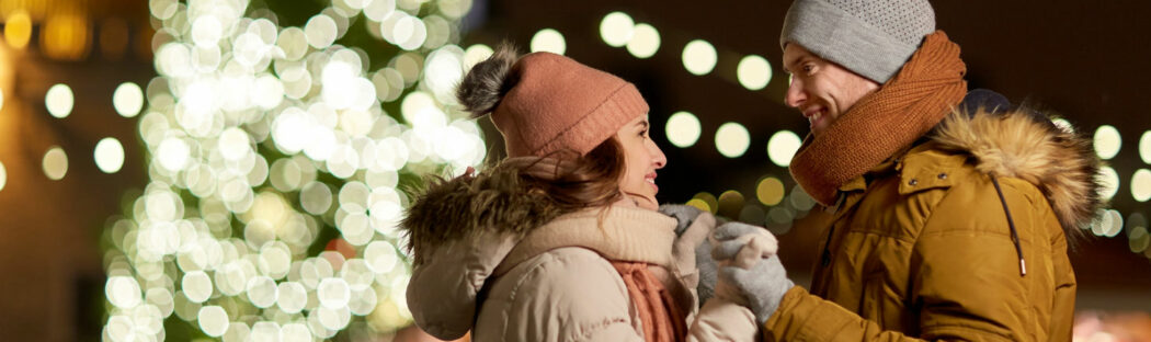 Couple in front of lights