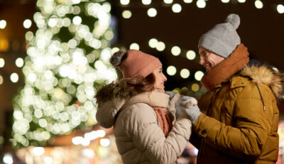 Couple in front of lights