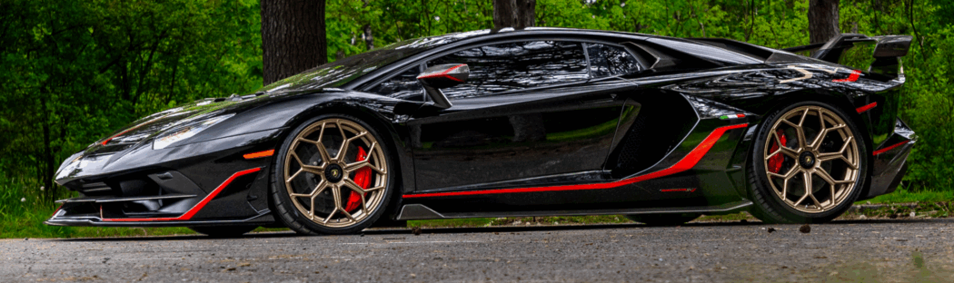 high end car in the woods