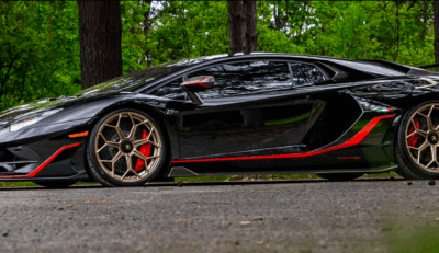 high end car in the woods